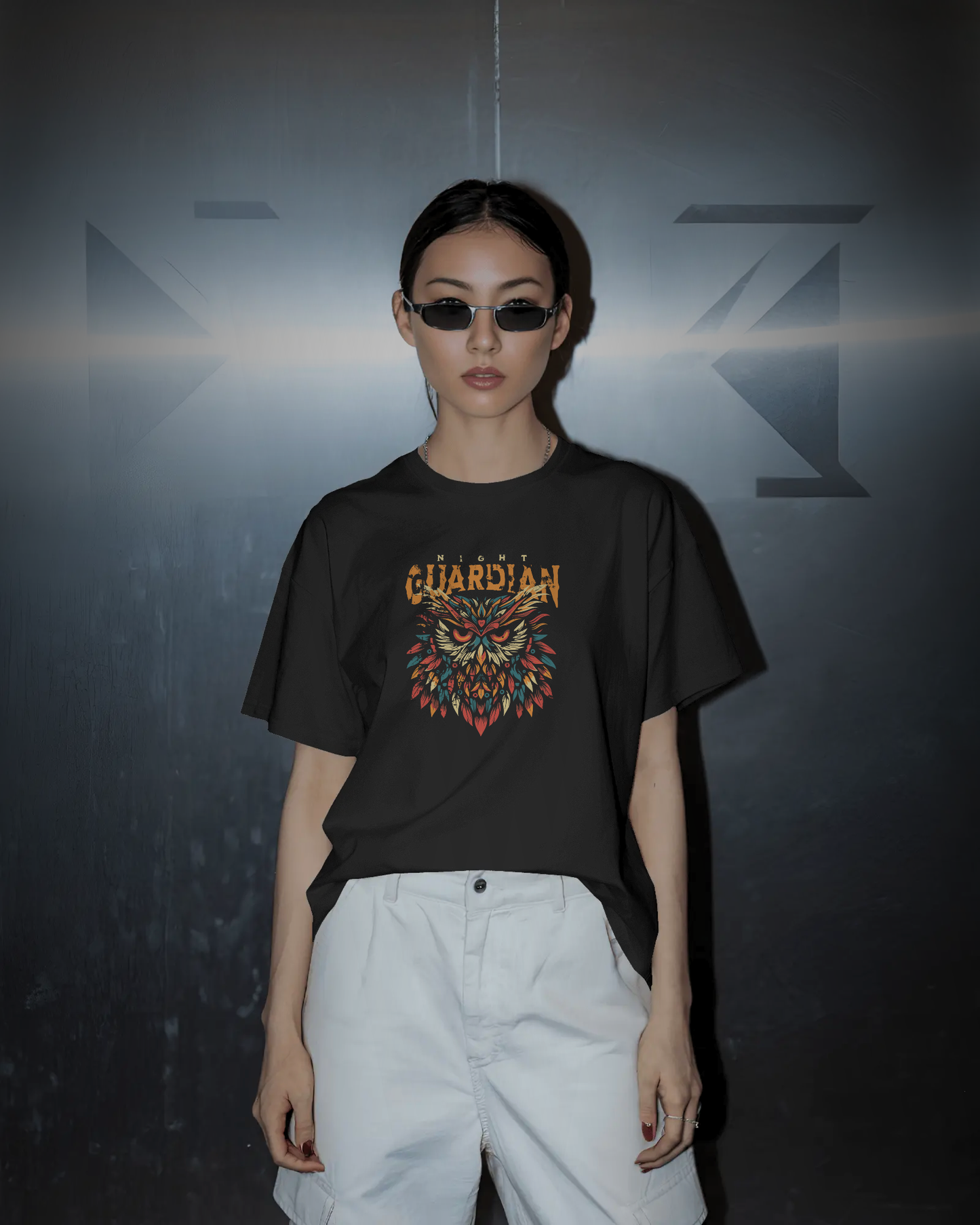 Serious, focused woman wearing Qurrito "Night Owl Dark Aesthetic" T-shirt. Mysterious mood Gothic design with colorful owl, regular fit.