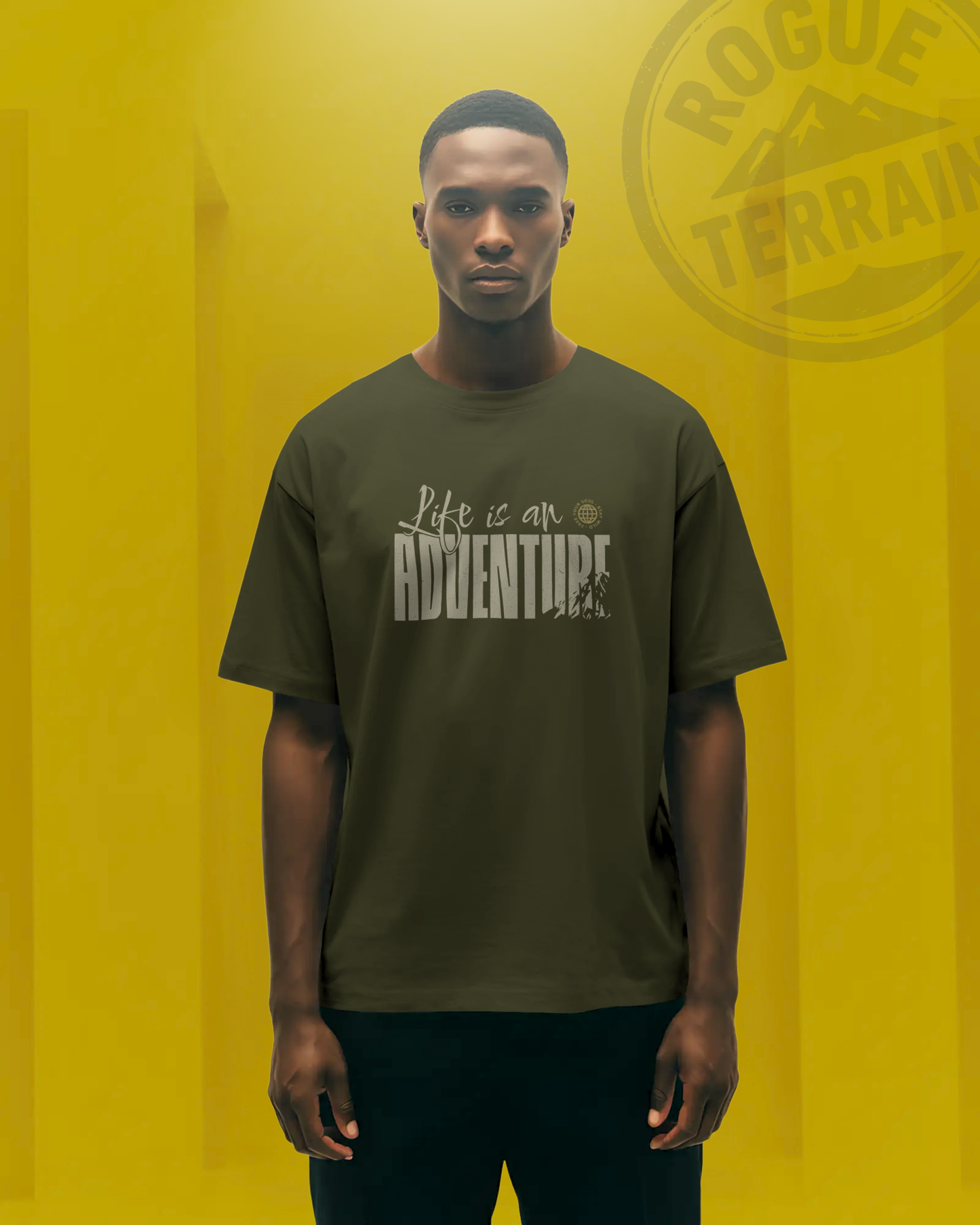 Male model wearing Qurrito’s Travel Inspired T-Shirt “Life is an Adventure” oversized tee in olive green. Crafted from premium cotton, this travel-themed streetwear tee radiates energetic, pumped, chill, relaxed, grumpy, and irritated moods — blending wanderlust spirit with bold urban fashion.
