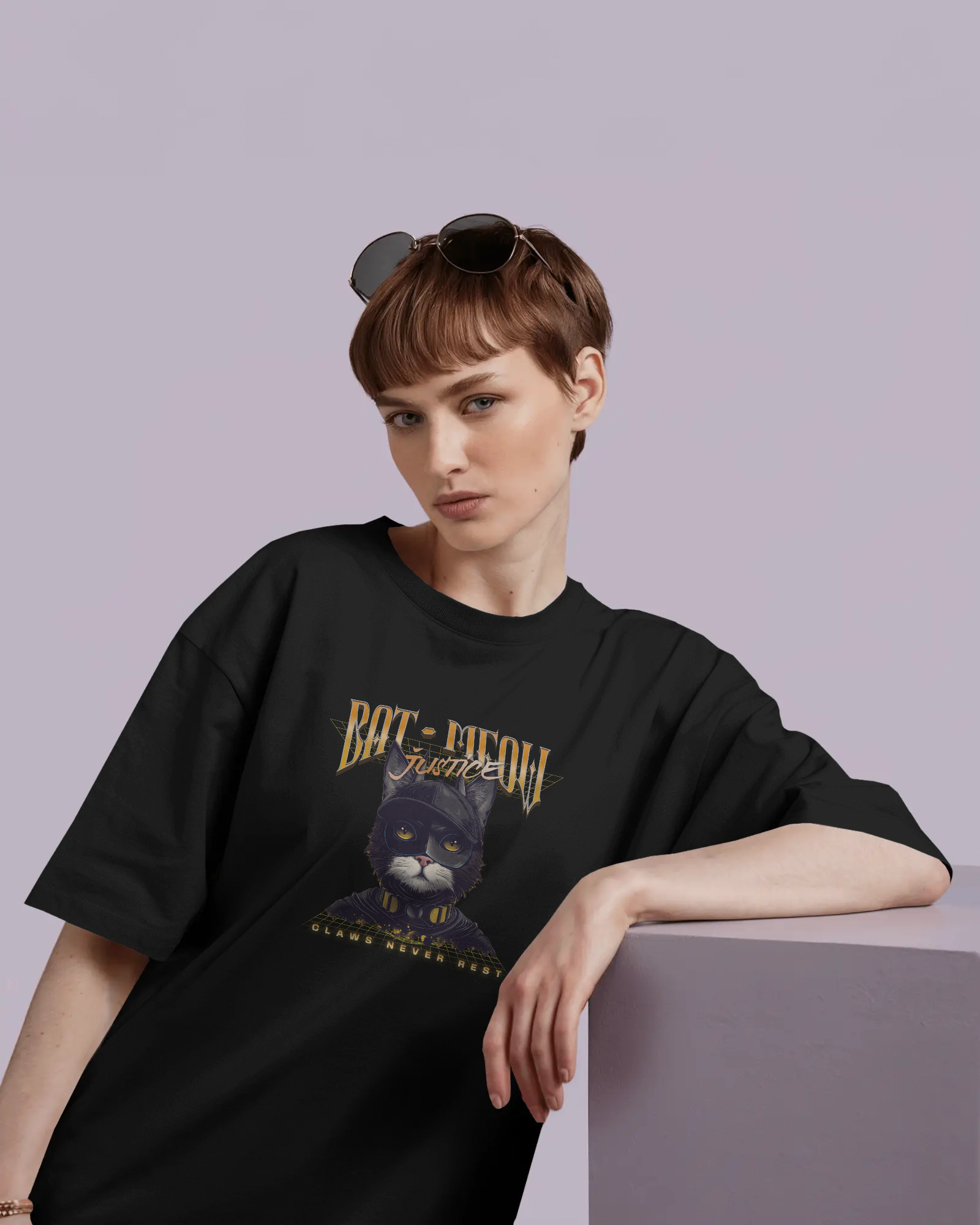 a woman wearing Pet Themed Graphic Tee – Bat Meow The Superhero Pet Lover by QURRiTO
