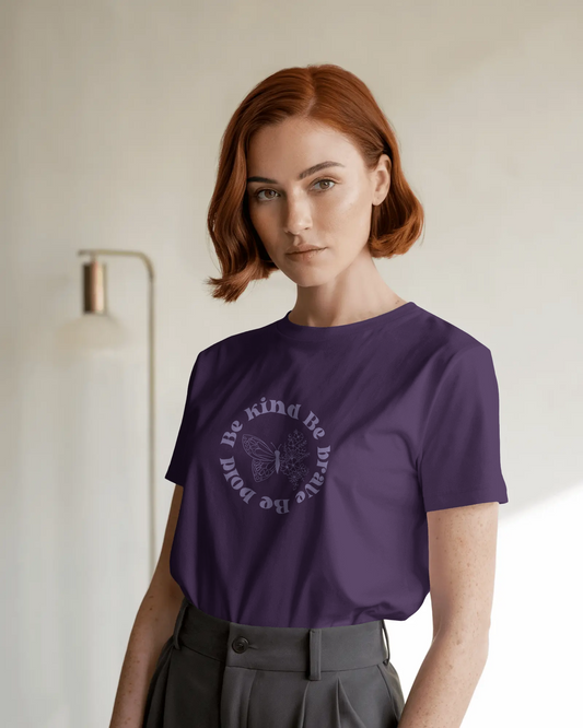 A woman wearing Be Kind Be Brave Be Bold Women’s T-Shirt – Empowerment Tee by Qurrito
