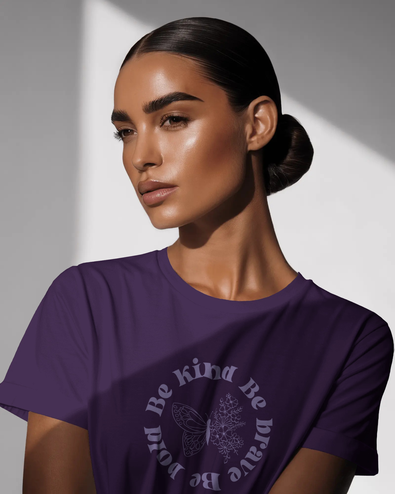 A woman wearing Be Kind Be Brave Be Bold Women’s T-Shirt – Empowerment Tee by Qurrito