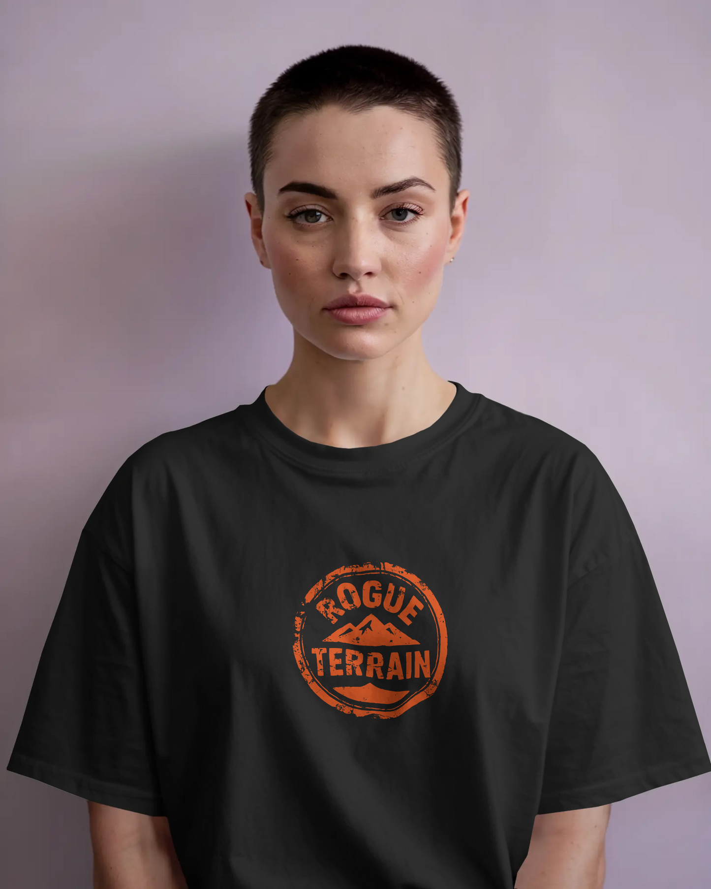 A woman wearing rugged Outdoor T-Shirt – Rogue Terrain Oversized Tee Fiery by Qurrito