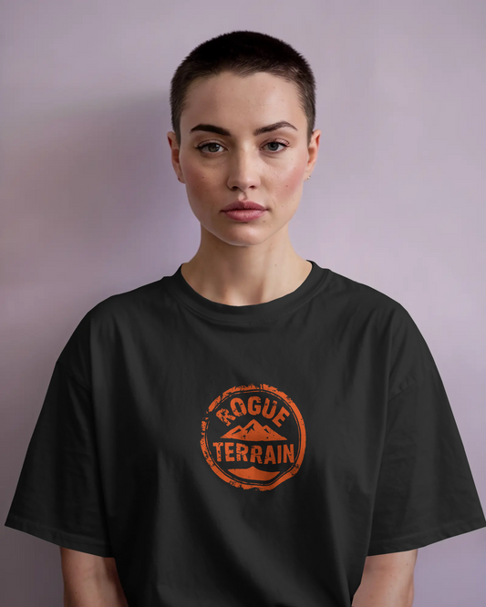 A woman wearing rugged Outdoor T-Shirt – Rogue Terrain Oversized Tee Fiery by Qurrito