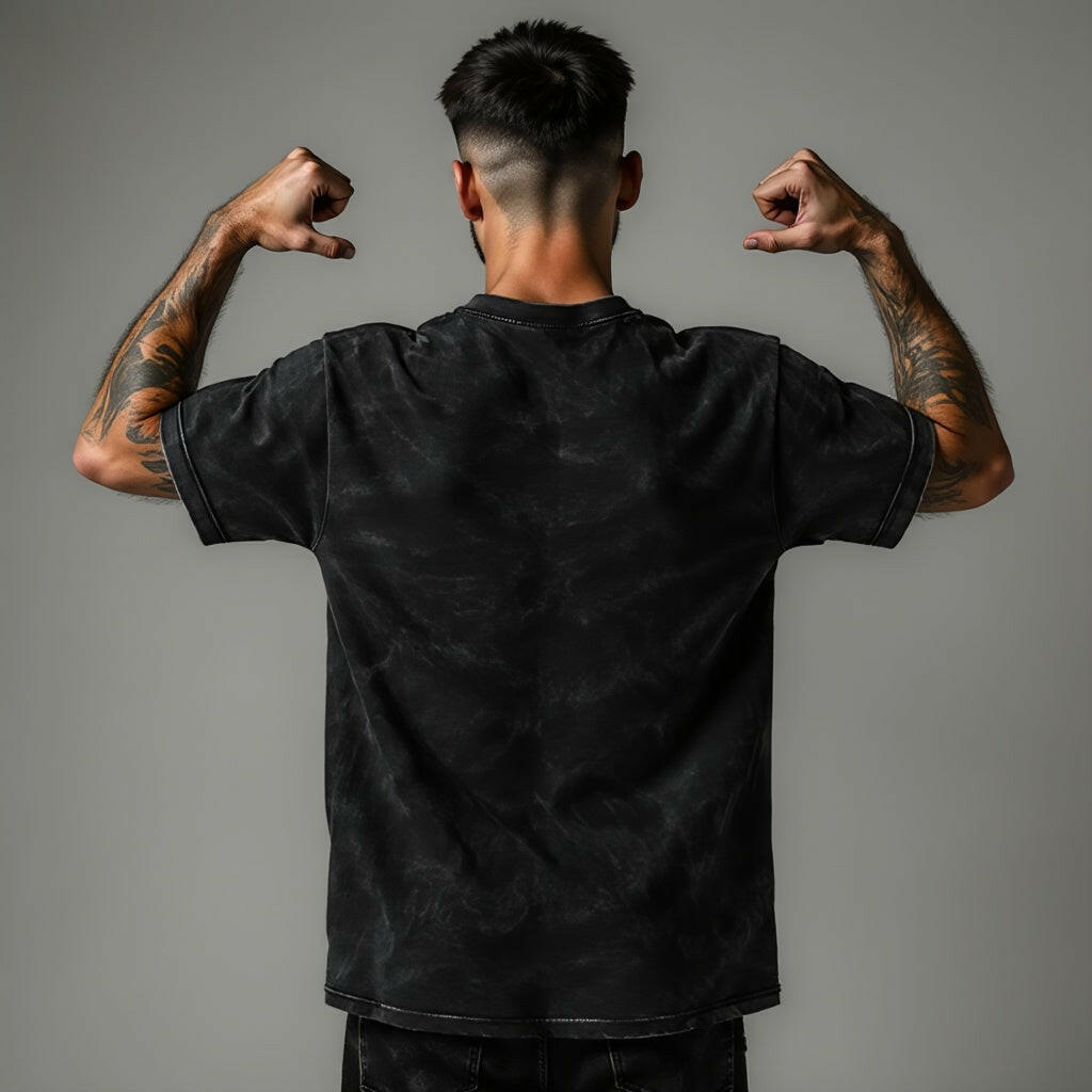 Male model showing off back of Qurrito’s Acid Wash Vintage Black Oversized T-Shirt made from mid-heavy premium cotton. With its washed finish and relaxed silhouette, this tee reflects mysterious, dark, confident, and bold moods — ideal for fearless streetwear style.