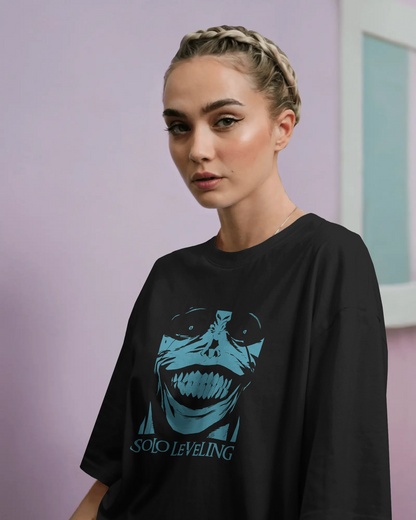 Female model wearing Qurrito’s black dark mysterious mood oversized cotton Anime Streetwear T-Shirt with blue Statue of God graphic from Solo Leveling, styled for women who love Korean manga-inspired streetwear and trendy oversized anime tees.