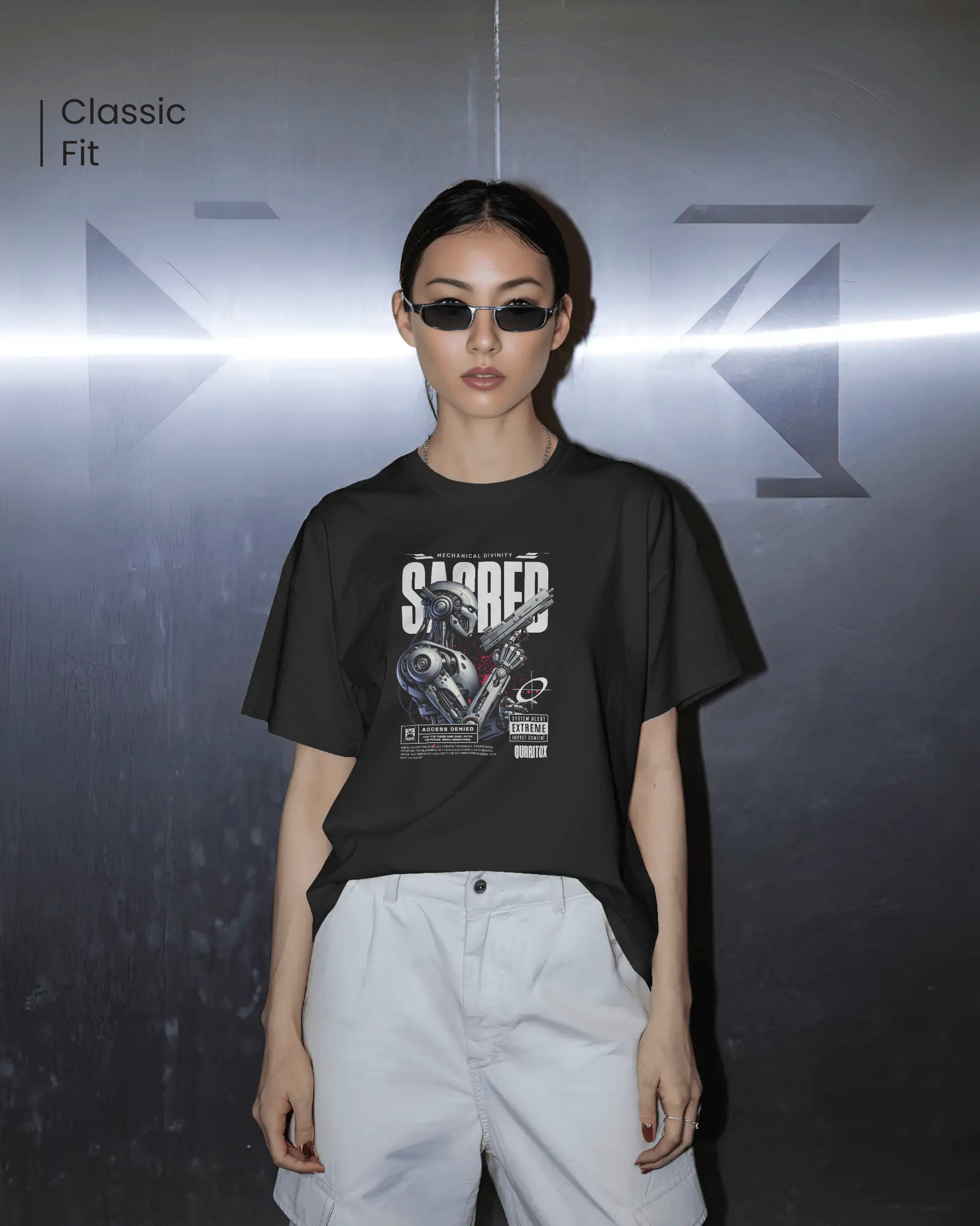 Woman styling Qurrito’s Futuristic Graphic T-Shirt – Sacred Divinity Regular Fit. The bold robotic artwork and dark tones deliver a confident, mysterious mood with a futuristic streetwear attitude.