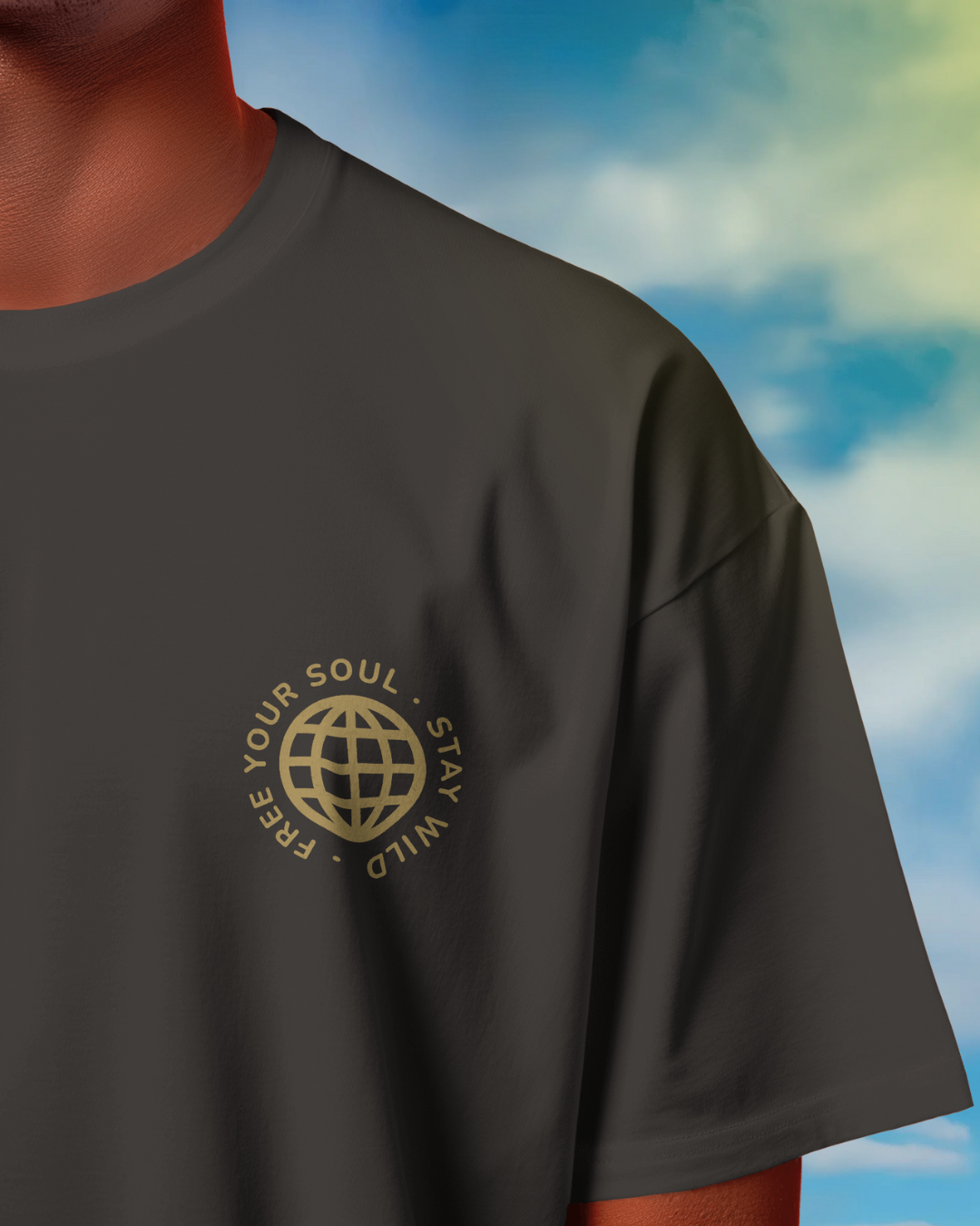 Close-up of Qurrito’s Motorbike Graphic Oversized T-Shirt highlighting the gold “Free Your Soul – Stay Wild” print. Crafted from soft premium cotton, this adventure-inspired tee captures energetic, pumped, confident, and bold moods — blending streetwear edge with travel spirit.