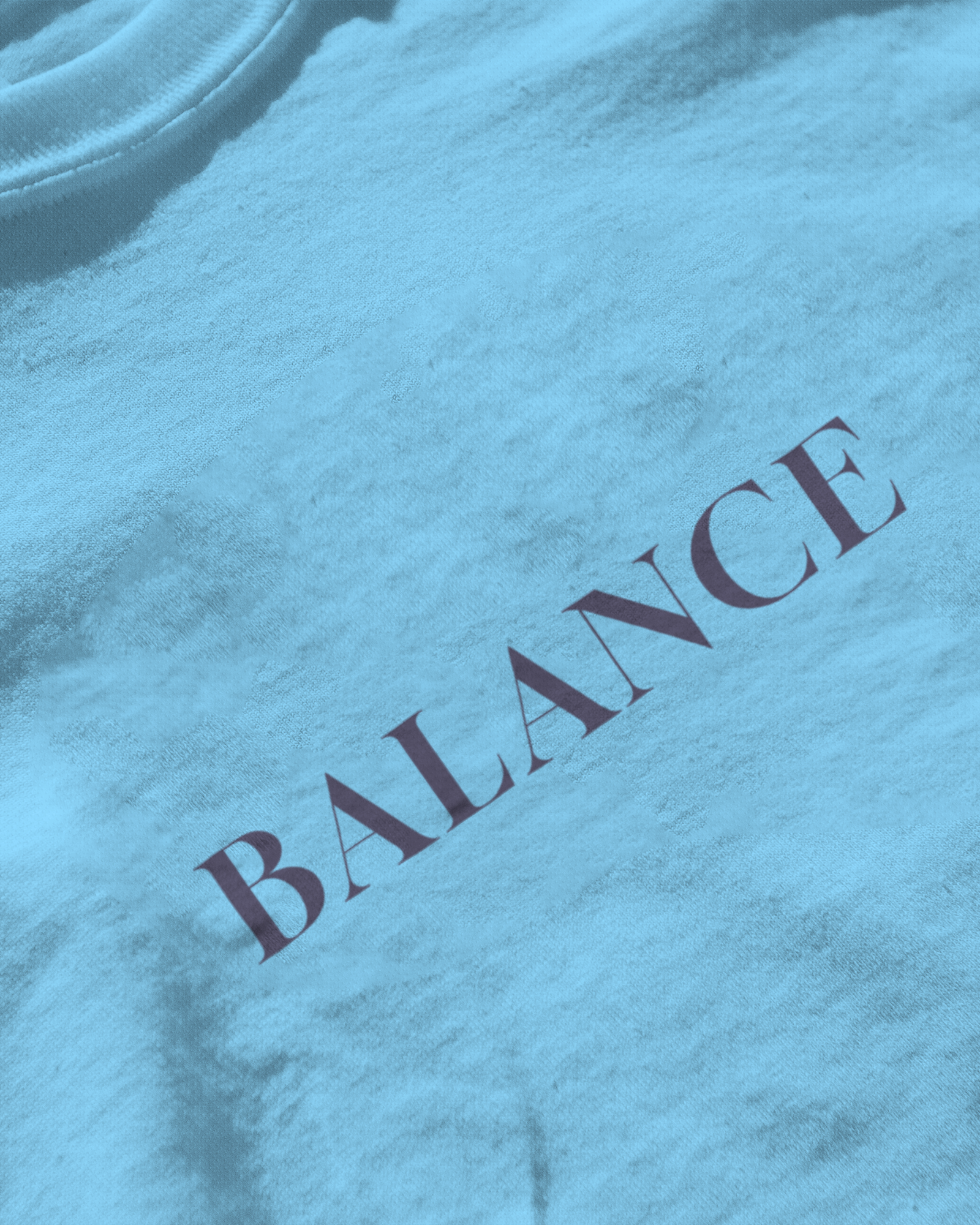 Close-up of Qurrito’s Balance Blue Regular Fit T-Shirt showing fine cotton texture and minimalist typography. Designed for serious, focused, chill, and relaxed moods — ideal for modern streetwear lovers who appreciate quiet confidence.