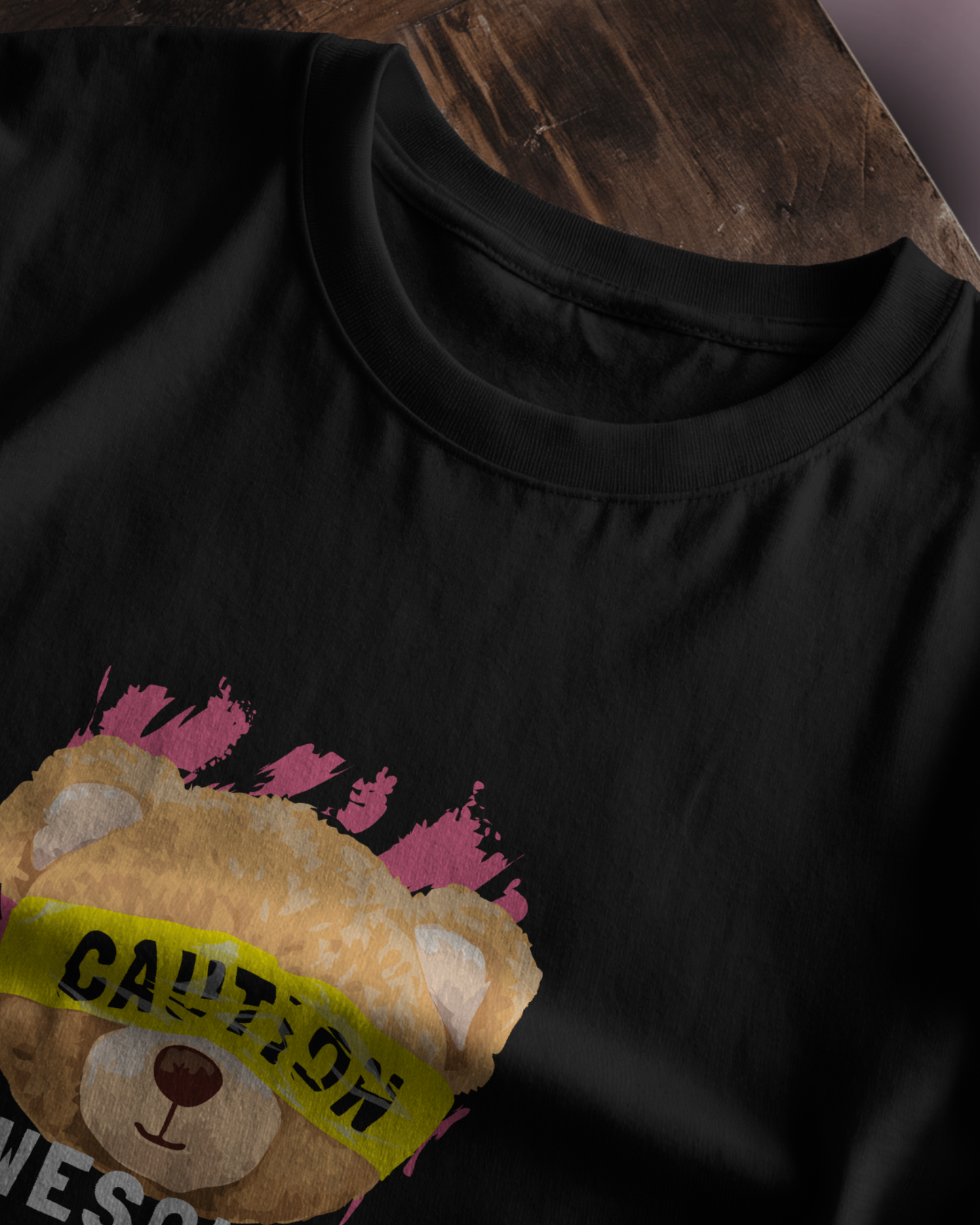 Close-up of Qurrito’s Caution Teddy Graphic T-Shirt in regular fit. The fun teddy bear artwork and bright caution label reflect a playful, quirky streetwear mood.