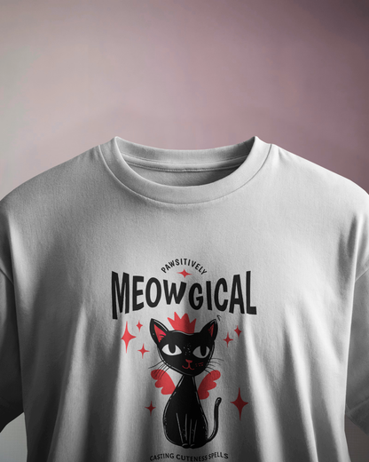 Qurrito White Oversized t-shirt with a black cat graphic and 'MEOWGICAL' text on a white background