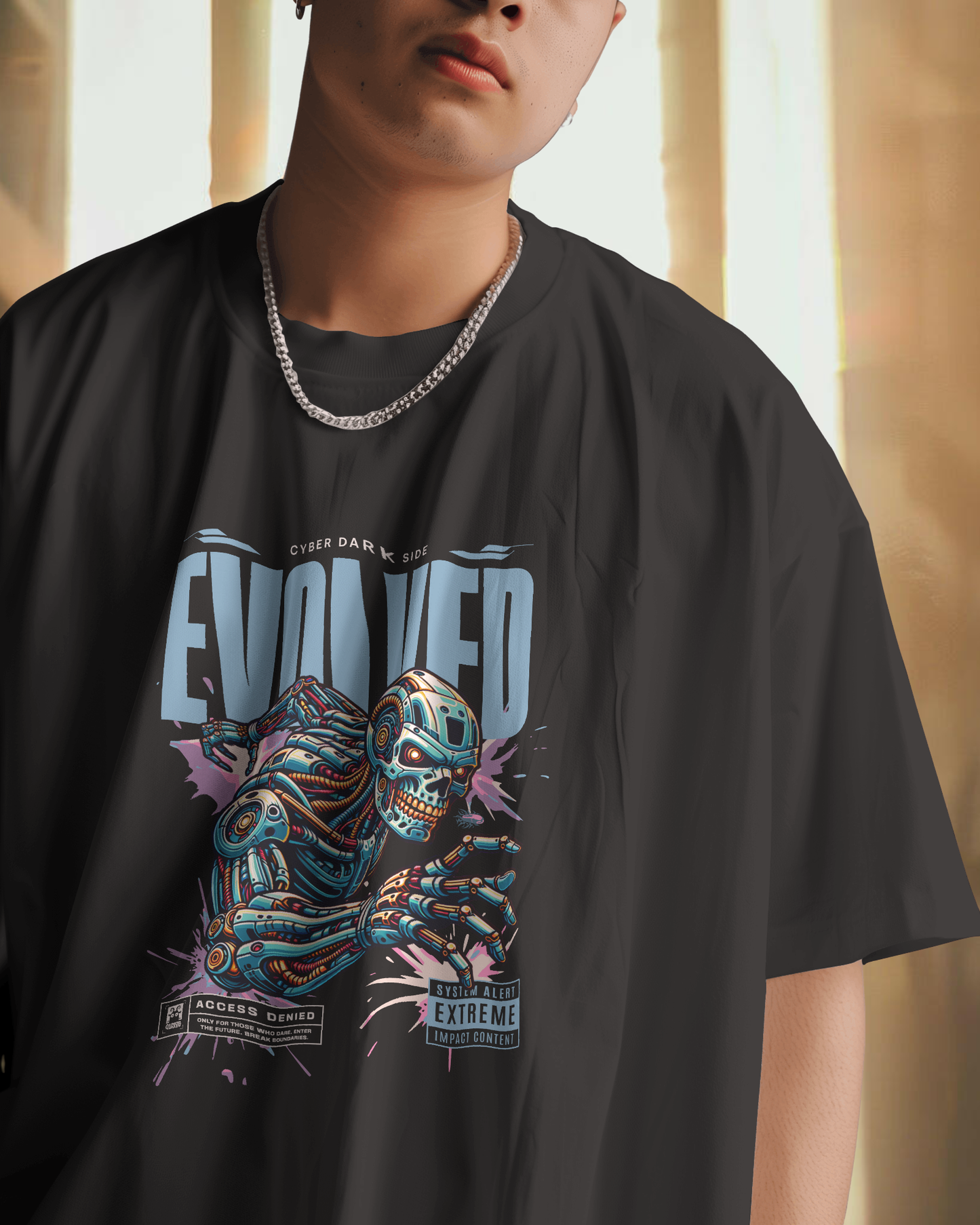 Man styling Qurrito’s Dark Side Evolved Oversized Cyberpunk T-Shirt in black with a chunky silver chain and denim jeans. The bold and dark futuristic print gives confident urban streetwear energy, perfect for men looking for graphic oversized tees and cyberpunk-inspired outfits.