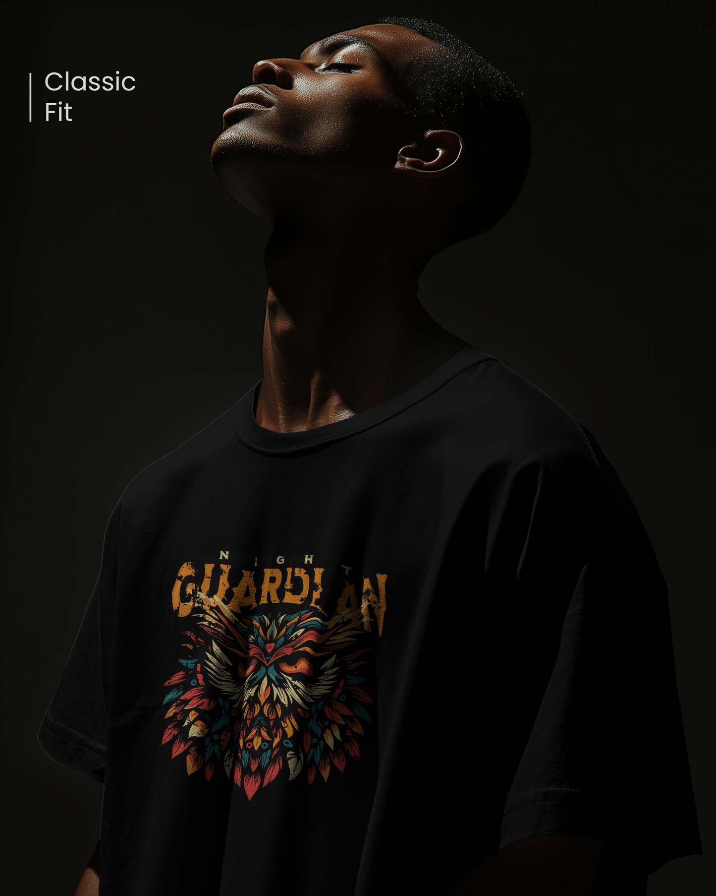 Closeup of man in dark, mysterious lighting wearing "Night Owl" T-shirt. Focused mood. Aesthetic streetwear regular fit design by Qurrito.