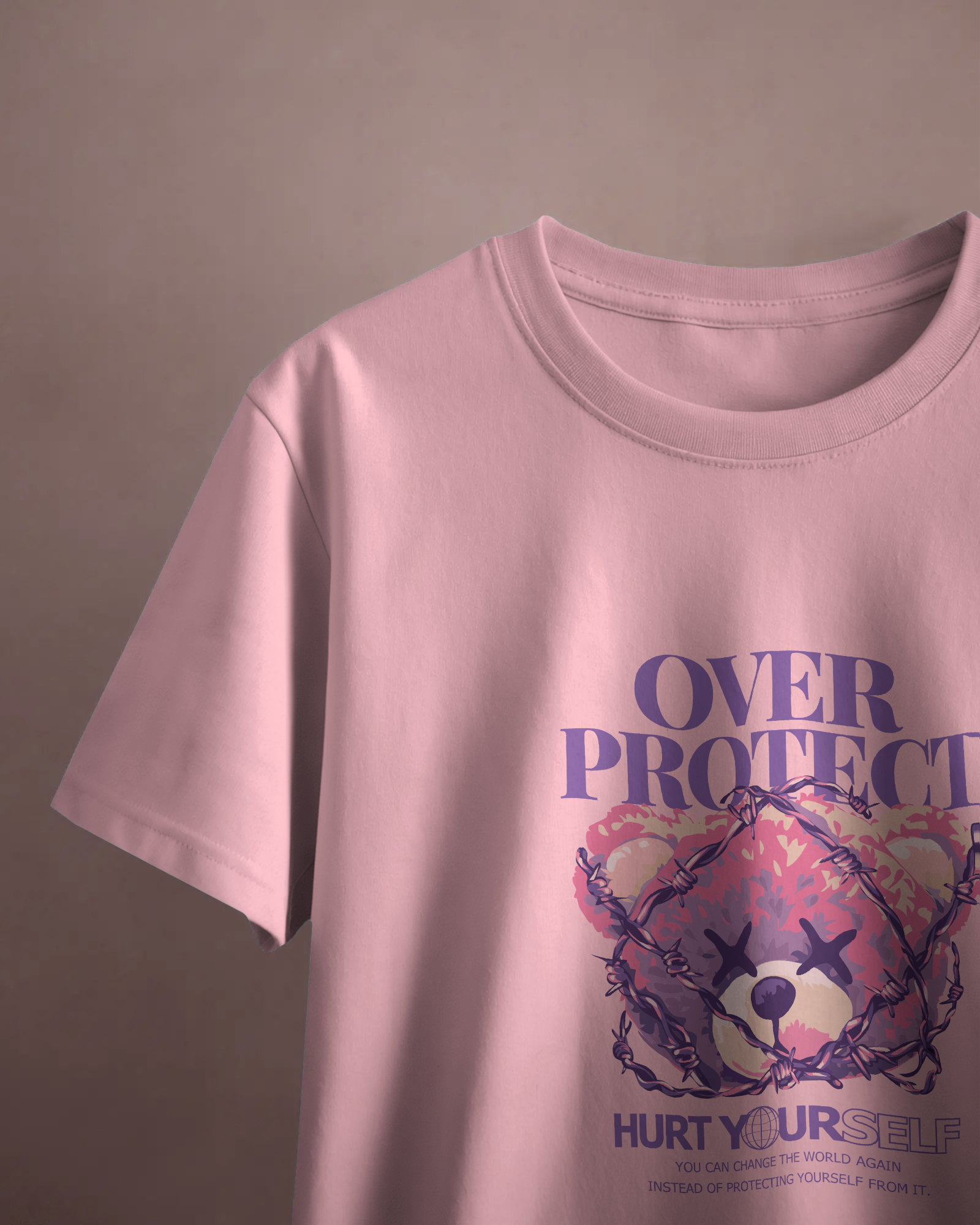 Close-up of Qurrito’s Edgy Pink Barbed Bear T-Shirt. The bold barbed teddy print merges playful energy with dark, mysterious streetwear aesthetics for a standout confident look.