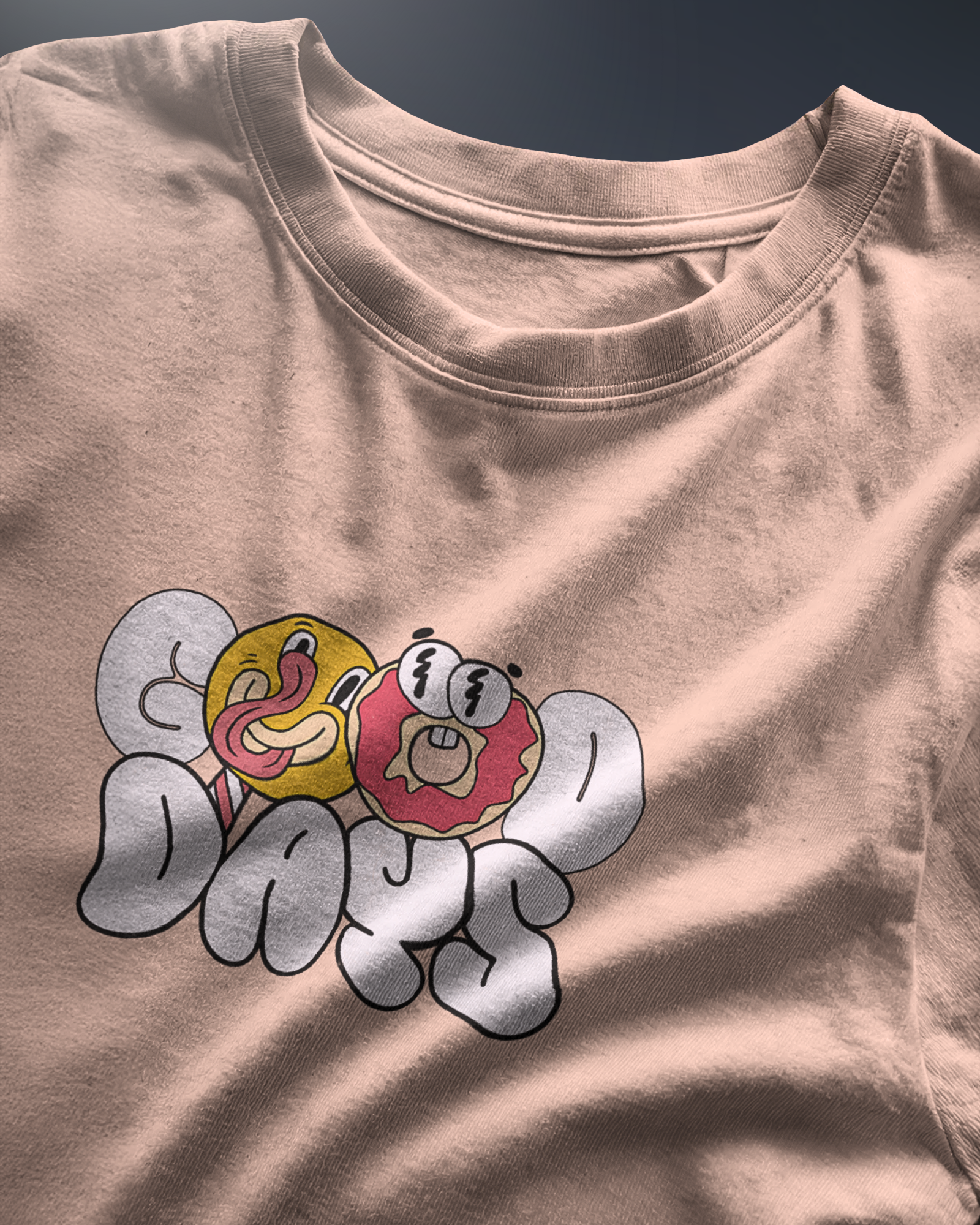 Energetic "Good Days Funky Typography Tee" graphic tee with a playful donut and smiley character. Peach colored Regular Fit shirt by Qurrito for a vibrant look.