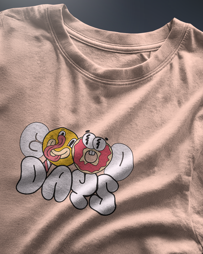 Energetic "Good Days Funky Typography Tee" graphic tee with a playful donut and smiley character. Peach colored Regular Fit shirt by Qurrito for a vibrant look.