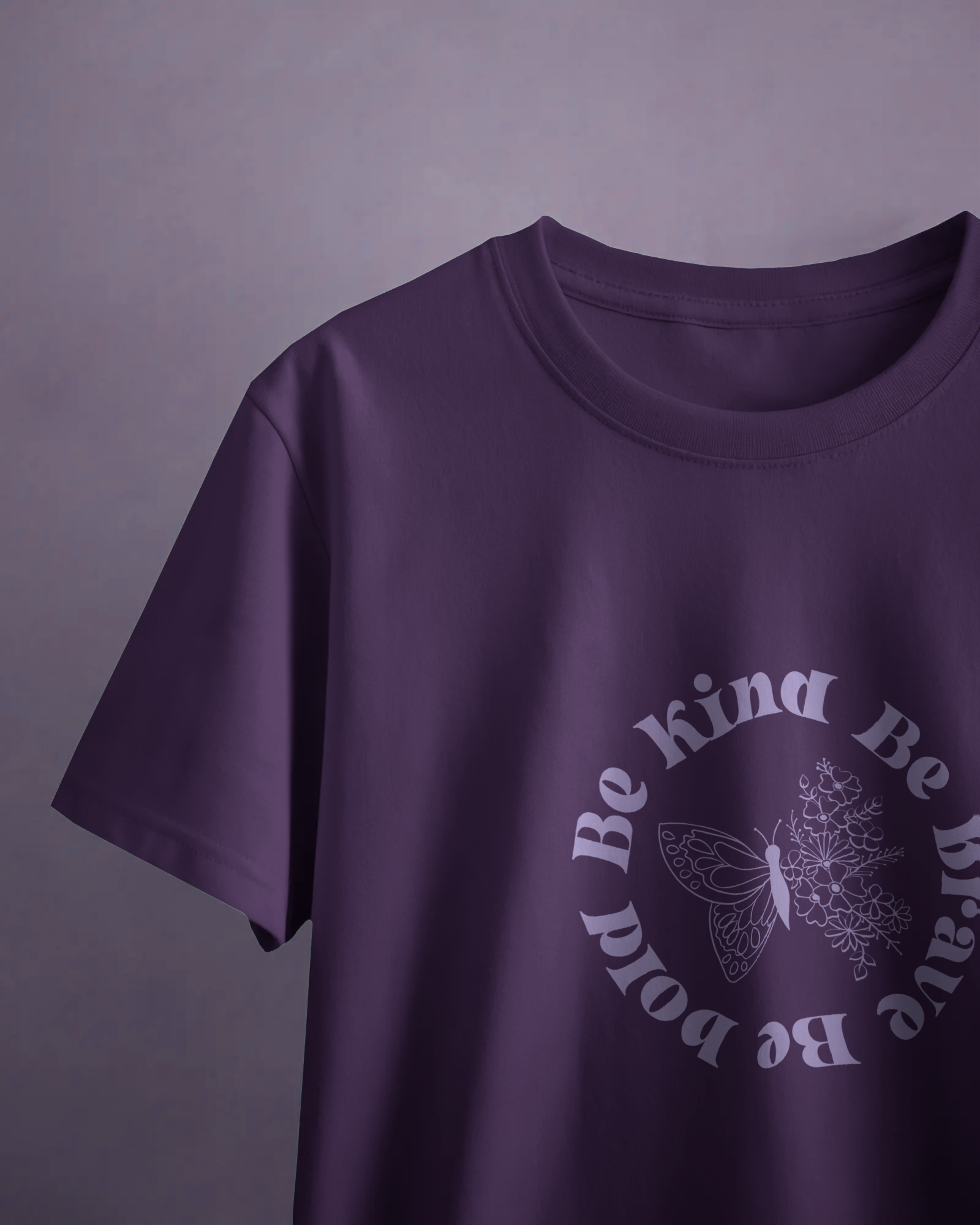 Close-up of Qurrito’s Floral Empowerment Tee featuring the “Be Kind Be Brave Be Bold” message. The purple cotton t-shirt radiates happy, romantic, affectionate, and cheerful mood energy — perfect for spreading good vibes daily.