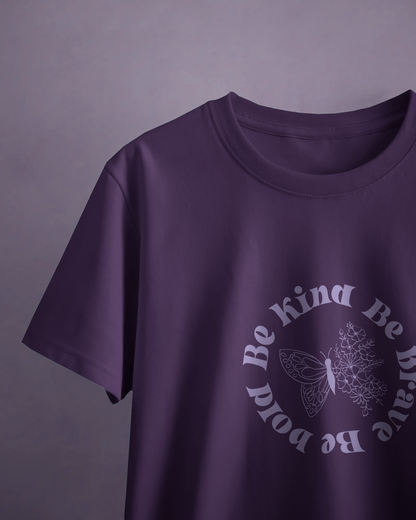 Close-up of Qurrito’s Floral Empowerment Tee featuring the “Be Kind Be Brave Be Bold” message. The purple cotton t-shirt radiates happy, romantic, affectionate, and cheerful mood energy — perfect for spreading good vibes daily.