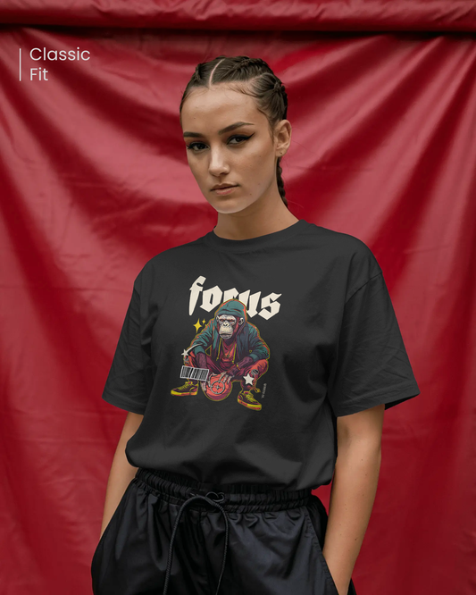 Female model wearing Qurrito’s Focus Basketball T-Shirt featuring a slam dunk monkey print. The black regular fit tee radiates energetic, pumped, playful, and quirky mood vibes — perfect for streetwear lovers with bold personalities.