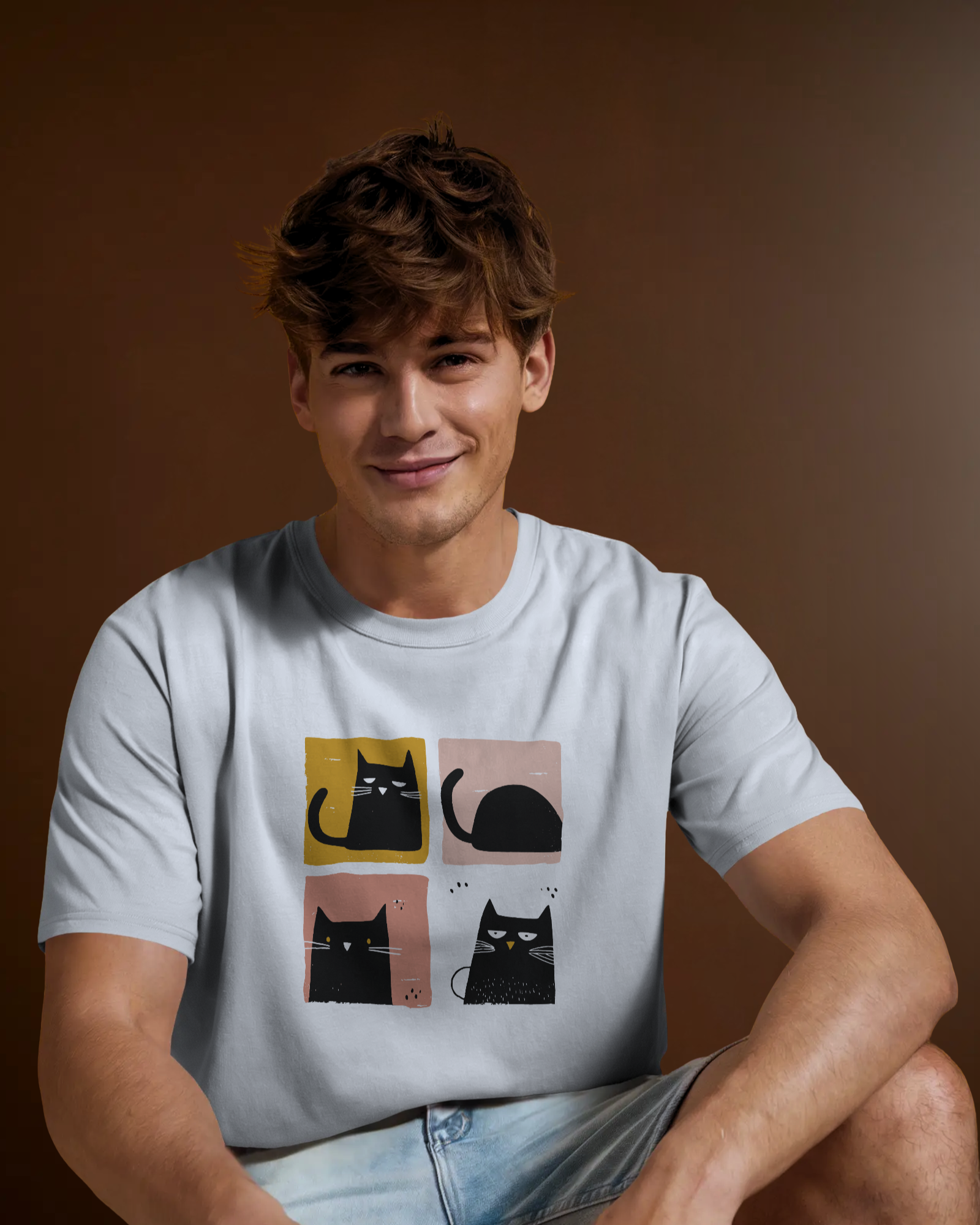 Male model wearing Qurrito’s Funny Cat Print T-Shirt featuring quirky black cat graphics in pastel blocks, made from soft premium cotton in a comfortable regular fit casual style. funny cat t-shirt, quirky graphic tee, casual cotton t-shirt for men.