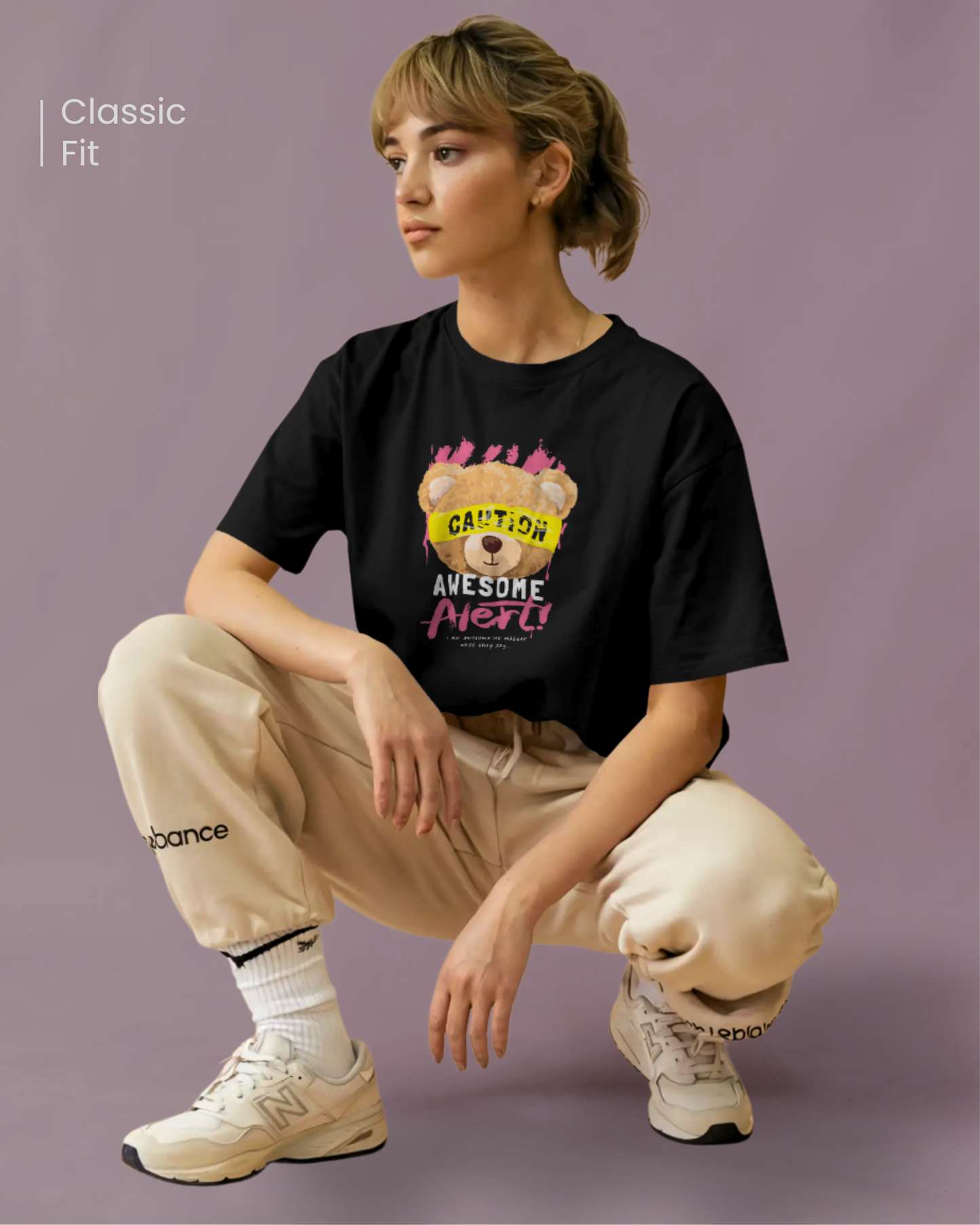 Woman wearing Qurrito’s Graphic Teddy Bear T-Shirt – Caution Teddy Regular Fit. The bold bear graphic with “Caution” tape adds a playful and quirky streetwear twist to casual style.