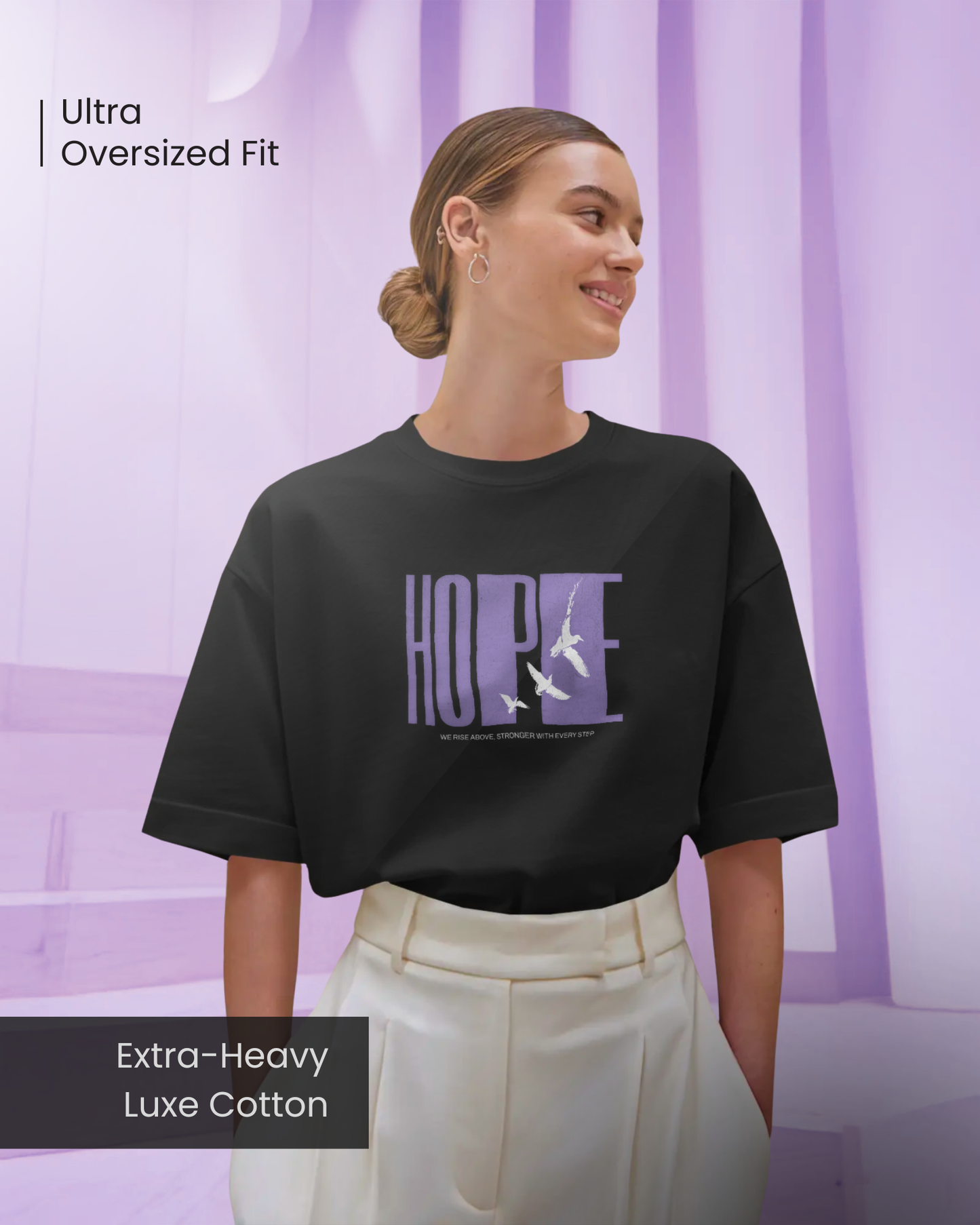 Smiling woman wearing Qurrito’s Hope Graphic Oversized Tee in black. Made from extra-heavy luxe cotton, it blends comfort and positivity with a cheerful, confident mood, perfect for casual chic outfits and uplifting everyday fashion.