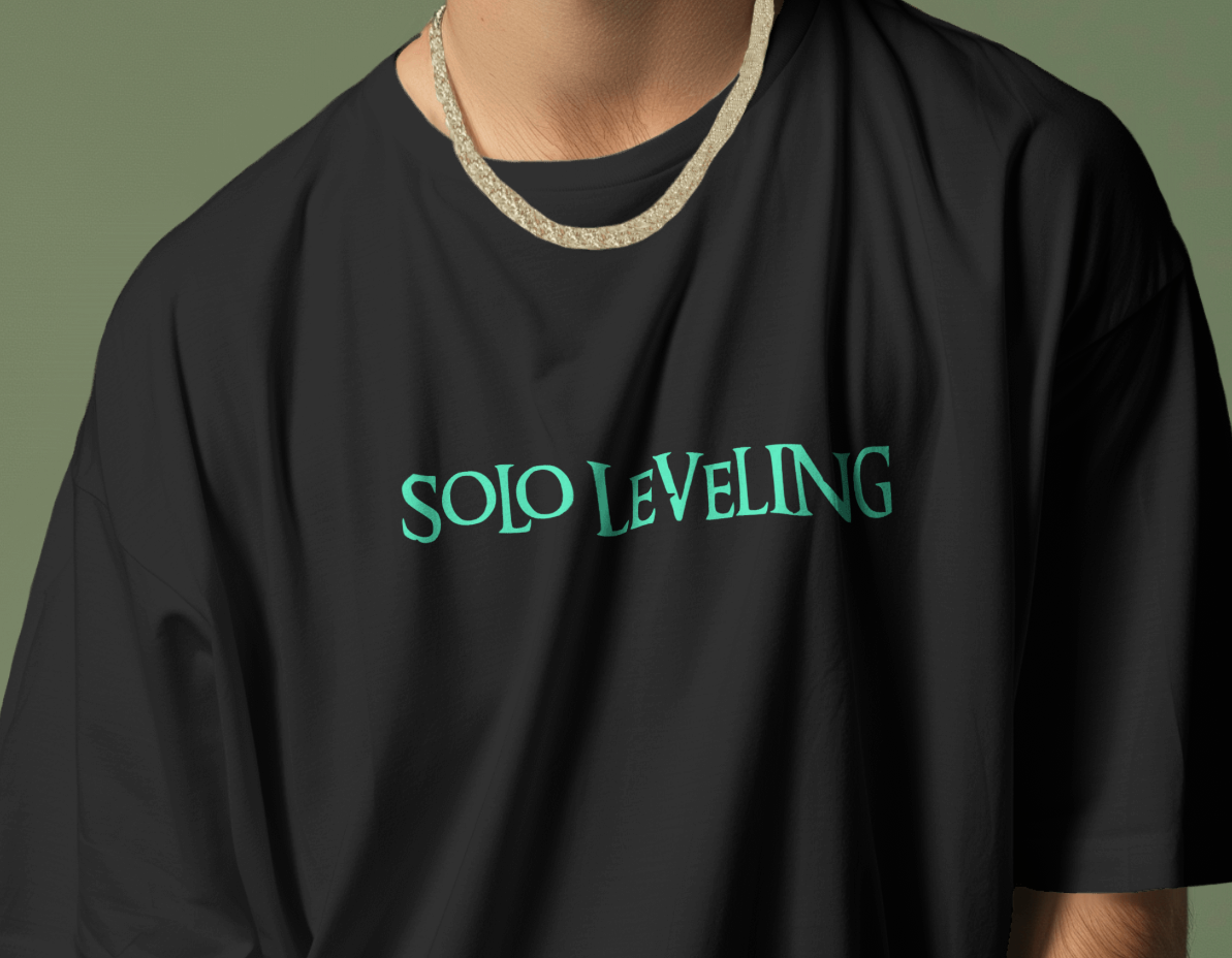 Front view of Qurrito’s Japanese Print Oversized T-shirt – Solo Leveling Stand Alone, featuring teal anime graphics on black mid-heavy premium cotton. This anime streetwear design radiates mysterious, dark, confident, bold, serious, and focused moods — perfect for fans of edgy Japanese fashion.