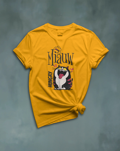 Qurrito Level 100 Hangry graphic t-shirt in Regular Fit displayed knotted in a flat lay style. The mustard yellow tee features an Energetic Funny Graphic print of a large, hungry cat with its tongue sticking out.