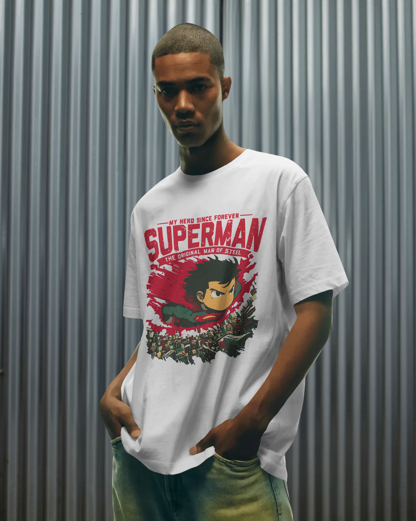 Qurrito Man of Steel graphic t-shirt in Regular Fit worn by a man. The white tee features a bold Confident Hero Graphic print of a cute, anime-style Superman flying over a cityscape with text "SUPERMAN THE ORIGINAL MAN OF STEEL." Confident mood.