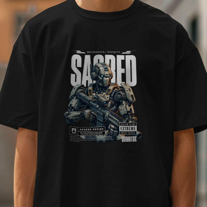 Close-up of Man wearing oversized "Sacred" T-shirt with a focused mood, mysterious cyborg graphic. Bold statement futuristic design. Soft Mid-Heavy Cotton feel. Qurrito.