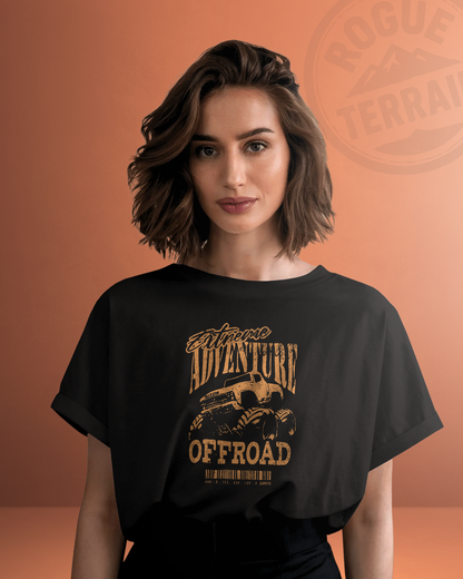 Female model wearing Qurrito’s Monster Truck Graphic Regular-Fit T-Shirt with “Extreme Adventure Offroad” print in rugged brown tones. This trailwear-inspired cotton tee blends urban streetwear with offroad energy, radiating energetic, pumped, playful, and quirky moods — perfect for adventure and fashion lovers.