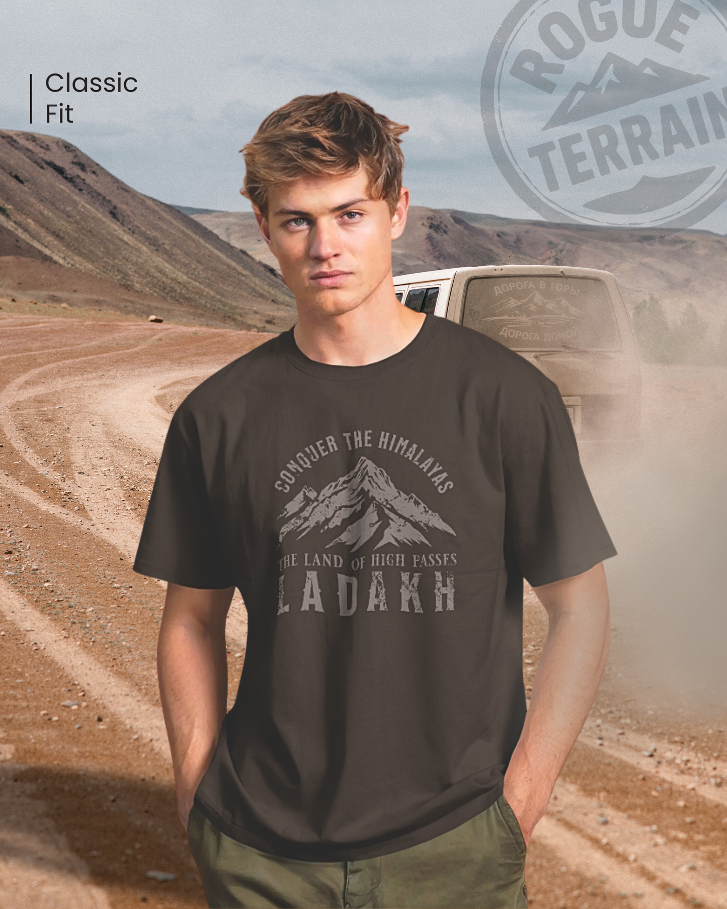 Male model wearing Qurrito’s Coffee Brown Ladakh Mountain Graphic T-Shirt with “Conquer the Himalayas – The Land of High Passes” design. A perfect travel tee that captures serious, focused, chill, relaxed, happy, and cheerful moods — ideal for road trips, outdoor adventures, and wanderlust souls.