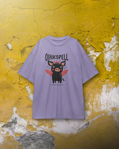 Lavender Oinkspell Oversized T-Shirt for Women by Qurrito hanging against a rustic yellow wall. This quirky graphic tee brings a fun, cheerful vibe for women looking for playful streetwear or pastel casual wear.