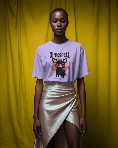 Woman in a Lavender Oinkspell Oversized T-Shirt styled with a metallic wrap skirt, blending quirky mood and chic fashion. The playful graphic design and happy color tones make it ideal for trendy women’s streetwear looks.