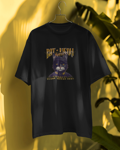 Close-up of a black oversized graphic tee with a detailed yellow and black "Bat-Meow Justice" cat superhero design. This quirky pet-themed shirt is a playful and fun addition to any streetwear collection. Ideal for cat lovers and comic fans.