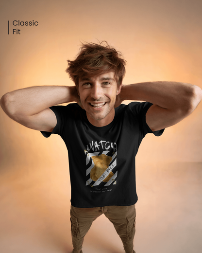 Man smiling in Qurrito’s Watch Your Back Black T-Shirt – Regular Fit teamed with khaki cargo pants, creating a bold and confident casual streetwear outfit for men. Perfect for searches like “men’s graphic tee with cargo pants” or “urban casual streetwear look.”