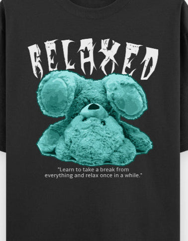 Oversized black t-shirt with upside-down turquoise teddy and "RELAXED" graphic, made from soft casual chillwear cotton.