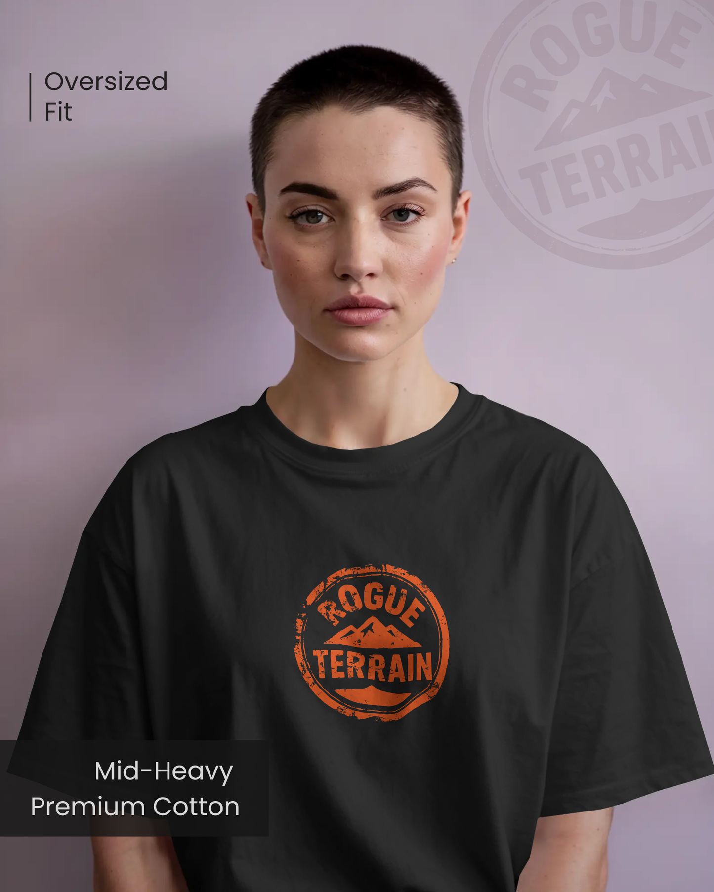 Female model styled in Qurrito’s Black Rogue Terrain Logo Oversized Tee, a rugged outdoor-inspired T-shirt made from mid-heavy premium cotton. The design embodies energetic, pumped, confident, bold, serious, and focused moods, blending outdoor aesthetics with modern urban streetwear fashion.