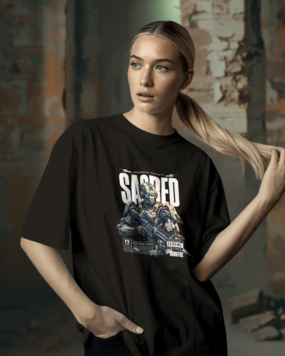 Confident woman wearing dark, oversized "Sacred" futuristic graphic T-shirt. Design features Mechanical Divinity robot art. Serious and bold streetwear style by Qurrito.