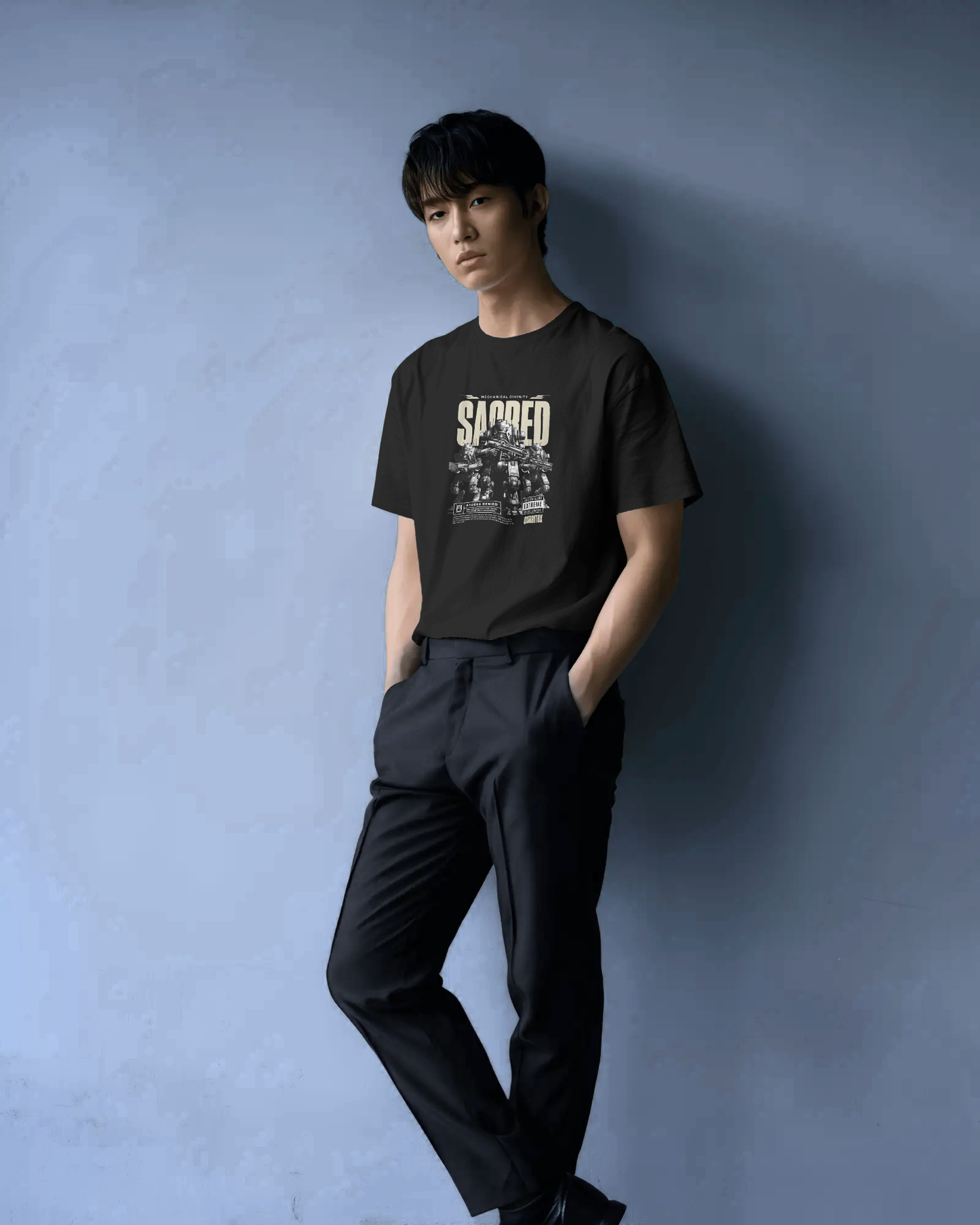 Man in Qurrito’s Sacred Mecha Divinity Cyberpunk T-Shirt. The black tee with sci-fi mecha print embodies a confident, dark, and futuristic mood — perfect for fans of cyberpunk and bold street fashion.