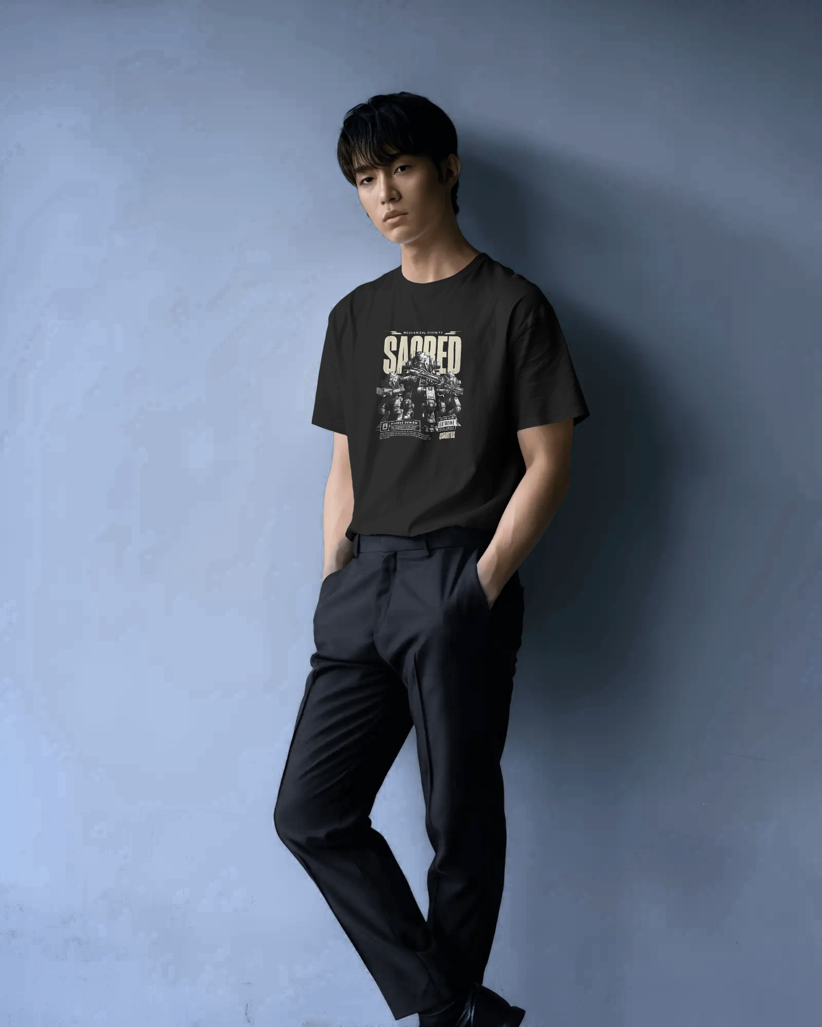 Man in Qurrito’s Sacred Mecha Divinity Cyberpunk T-Shirt. The black tee with sci-fi mecha print embodies a confident, dark, and futuristic mood — perfect for fans of cyberpunk and bold street fashion.