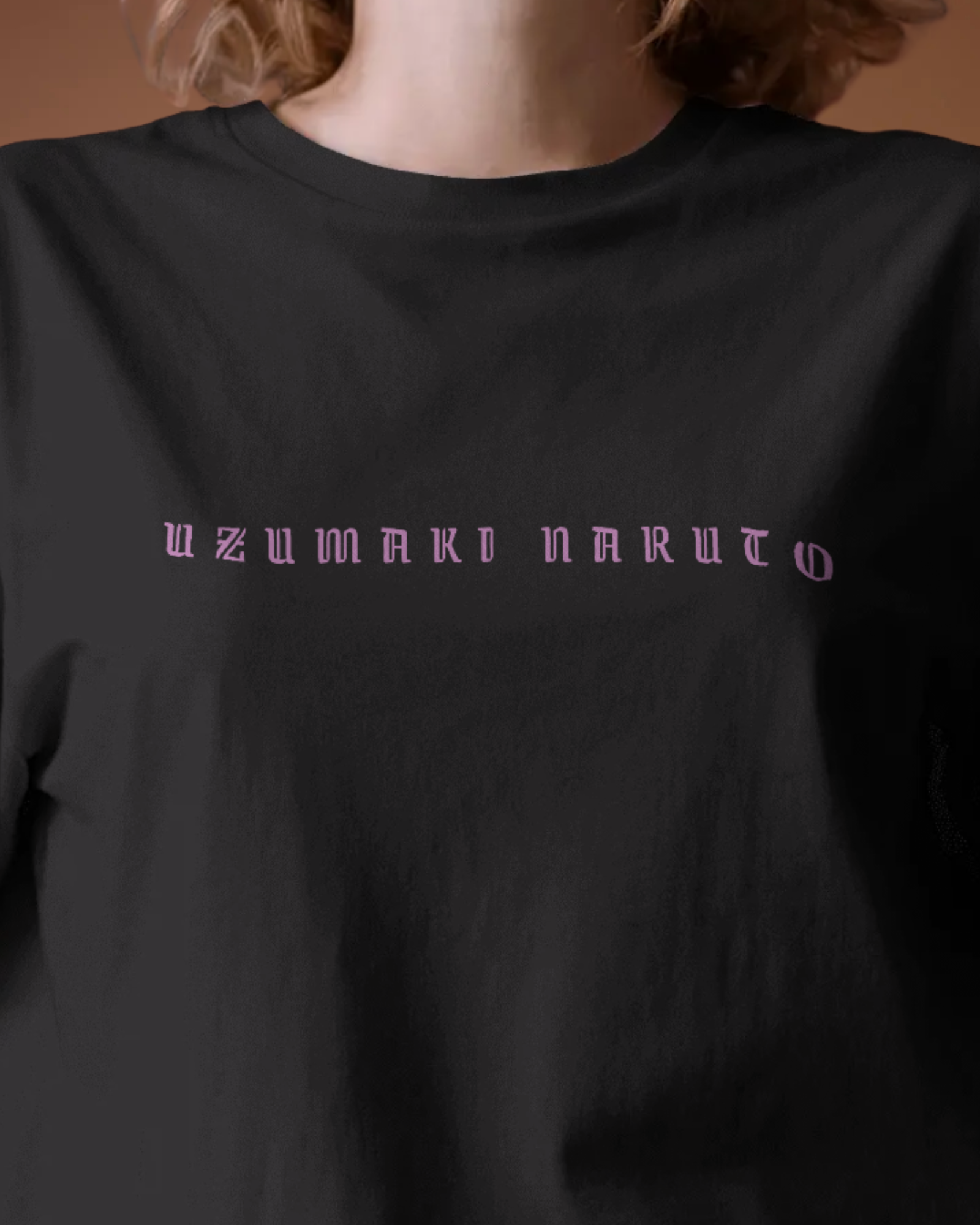 Close-up of Qurrito’s Uzumaki Naruto Oversized Anime Graphic Tee featuring minimalist purple text on premium cotton. This vintage anime-inspired streetwear tee embodies mysterious, dark, confident, bold, energetic, and pumped moods in every detail.