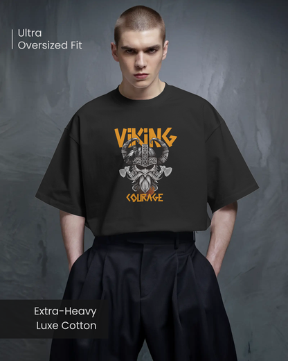 Model wearing Qurrito’s Oversized Viking Courage T-Shirt crafted from extra-heavy luxe cotton in an ultra-oversized fit. The orange and grey warrior artwork gives a focused, pumped-up aesthetic, ideal for unisex streetwear outfits or bold fashion statements.