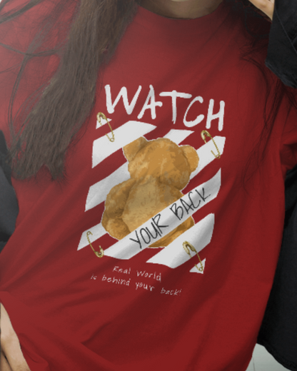 Female model wearing Qurrito’s “Watch Your Back” Red Tee featuring teddy bear graphic and diagonal stripe design, made from premium cotton in a regular urban streetwear fit.
