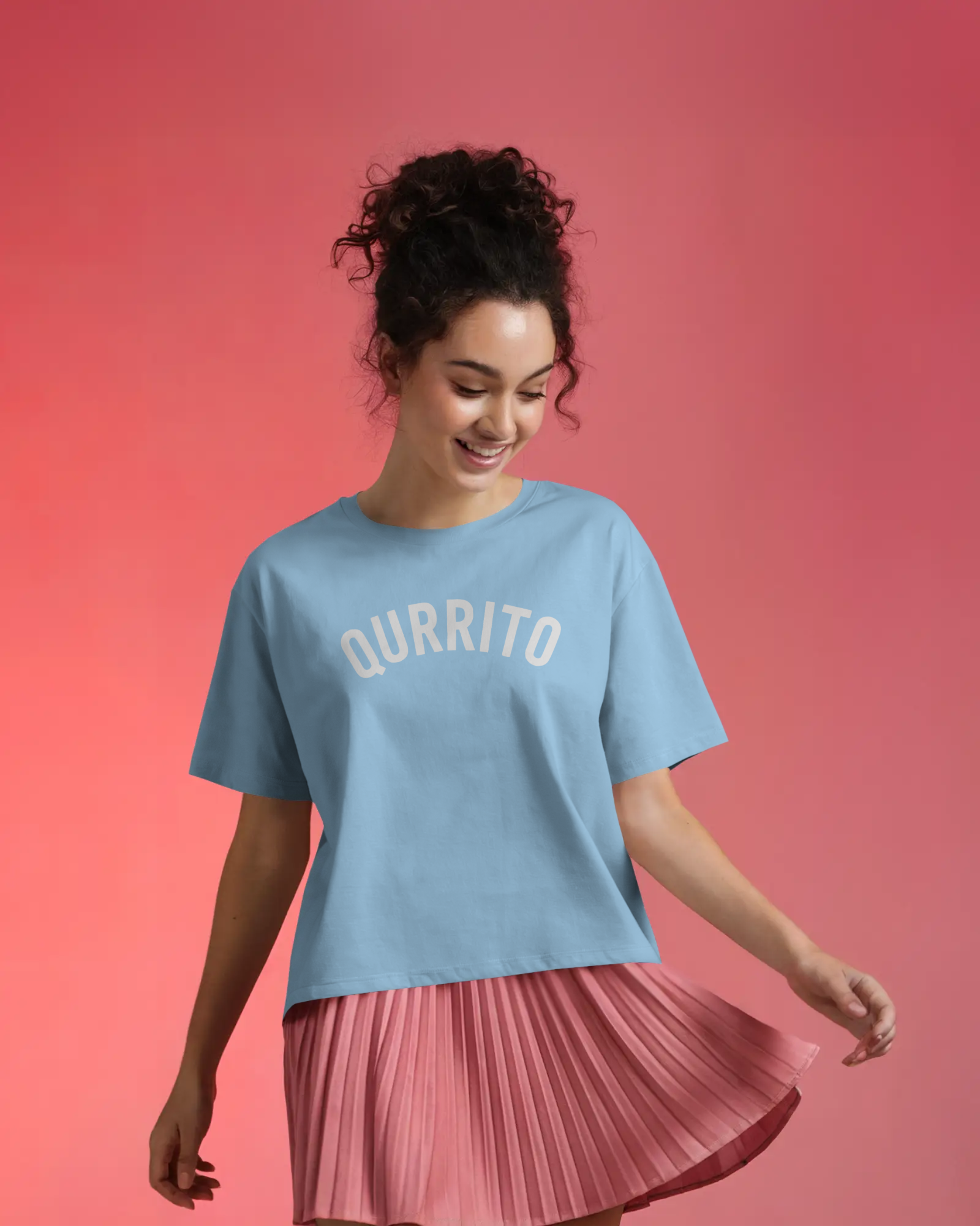 Branded oversized t-shirt for men and women in sky blue with Qurrito arch logo, styled for casual streetwear vibes.
